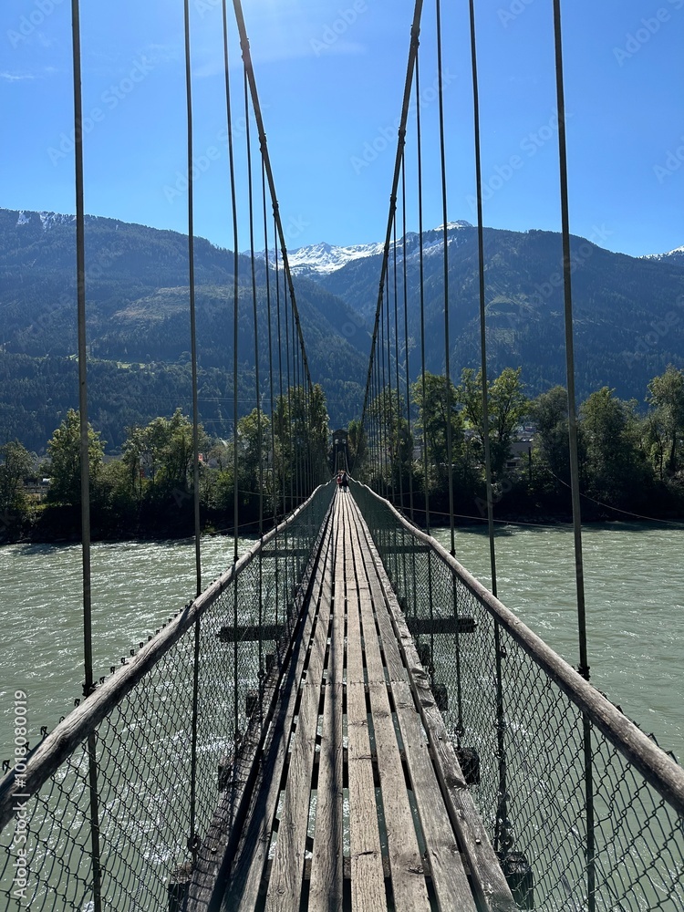 Obraz premium bridge over the river alps mountains