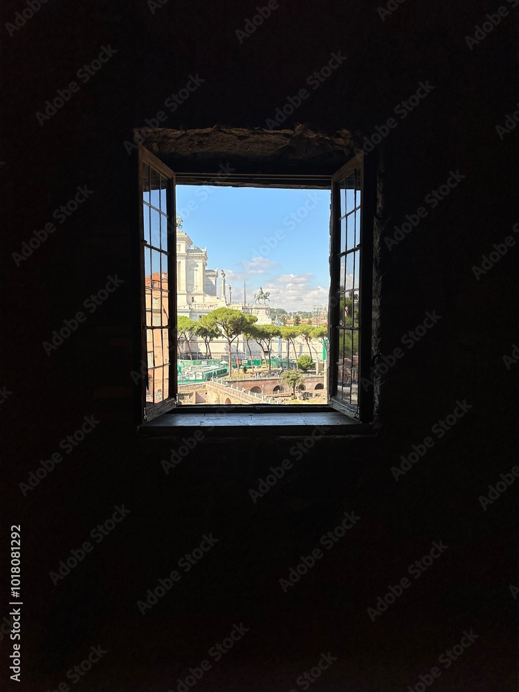 Fototapeta premium window in the house leading to the summer street of rome