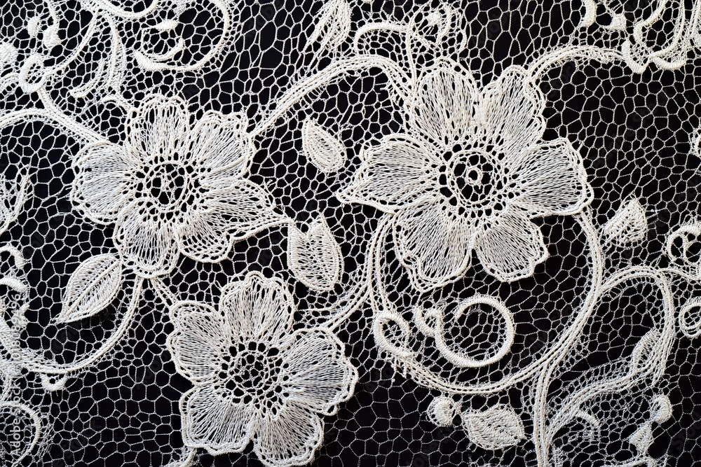 Elegant White Floral Lace Texture on Black Background Elegant White Floral Lace Texture on Black Background