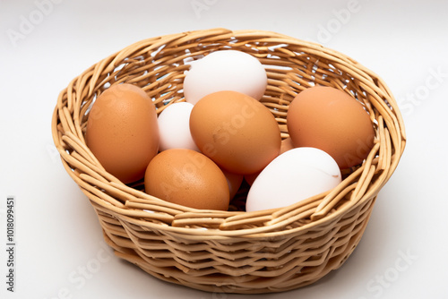 Wallpaper Mural Basket of eggs in white on . food easter egg concept. basket of chickens in wicker with white and red eggs on a . a chicken in a basket with colored eggs on it on a lifestyle white. Torontodigital.ca