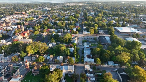 Aerial view of Carlisle, Pennsylvania, featuring a mix of historic buildings, residential areas, and tree-lined streets on a clear day.