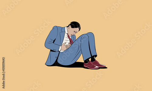 Man in suit sitting on ground, holding stomach in pain