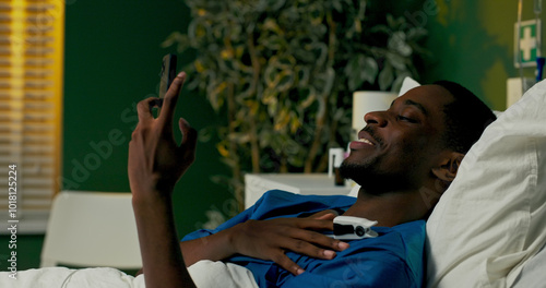 African patient holding a video call on his phone, chatting with a support group or fellow patients, finding solace in shared experiences.