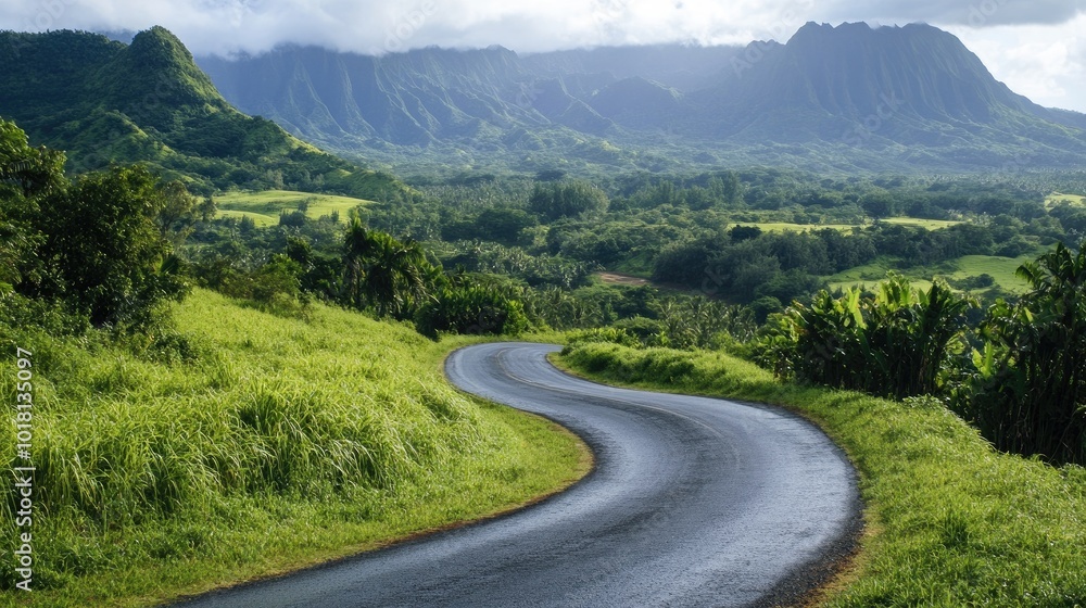Wide view of a picturesque, winding road through a lush green landscape with scenic mountains in the distance Wide view of a picturesque, winding road through a lush green landscape with scenic mountains in the distance