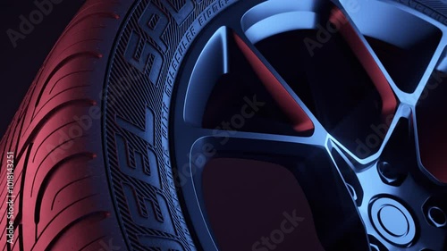Close-up of a sport tire slowly rotating. Neon light on dark background. Realistic 3d render.