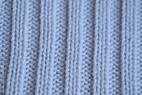 Macro texture of elastic of wool blue crocheted sweater as background, close-up of pastel blue crocheted front, blue crocheted back, texture of wool wool, blue crocheted front