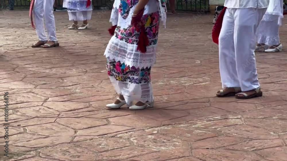 Handheld close-up shot tracking the footwork of traditional Mexican dancers performing in Valladolid, Mexico. 4K at 30 FPS Handheld close-up shot tracking the footwork of traditional Mexican dancers performing in Valladolid, Mexico. 4K at 30 FPS