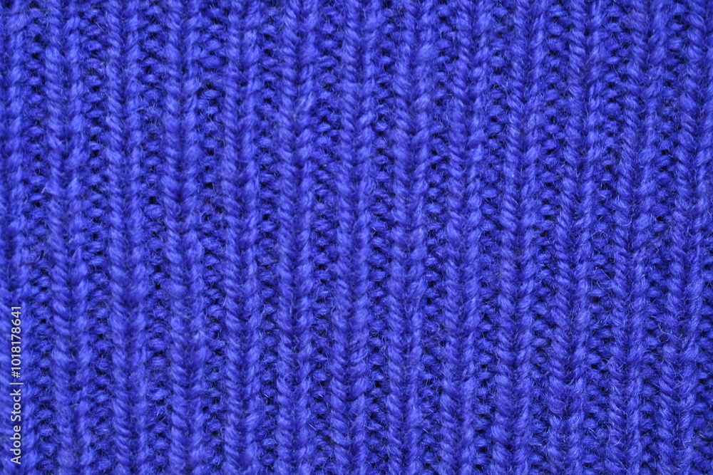 Macro texture of purple wool crochet sweater as background, close-up of purple crochet front surface, texture of woolen wool, crochet front surface Macro texture of purple wool crochet sweater as background, close-up of purple crochet front surface, texture of woolen wool, crochet front surface