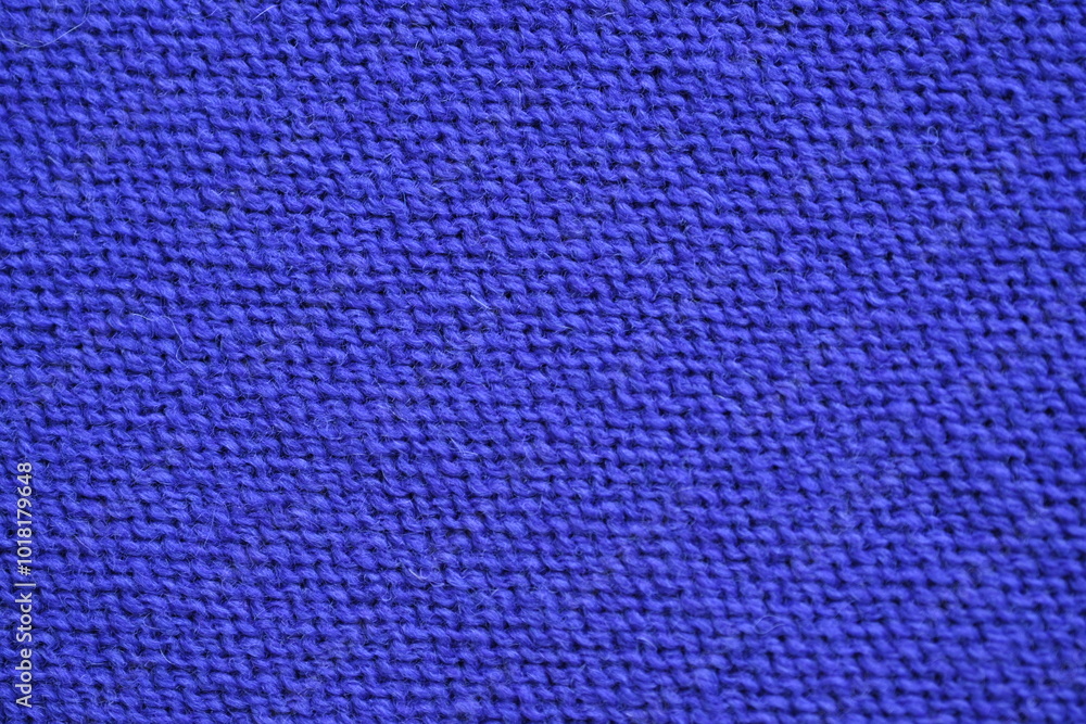 Macro texture of purple wool crochet sweater as background, close-up of purple crochet front surface, texture of woolen wool, crochet front surface Macro texture of purple wool crochet sweater as background, close-up of purple crochet front surface, texture of woolen wool, crochet front surface