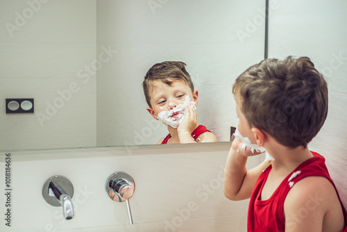 Young boy mimics shaving in front of bathroom mirror