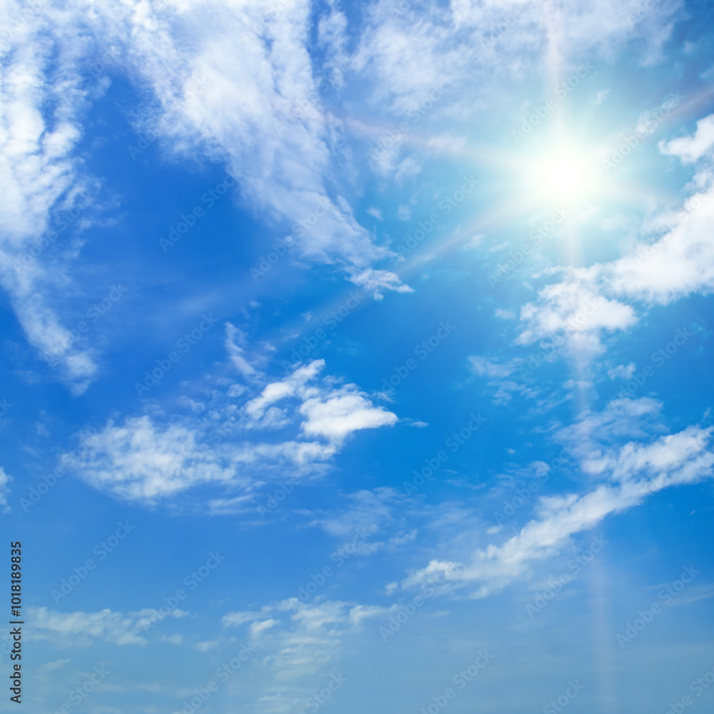 Blue sky with white clouds and sun. Blue sky with white clouds and sun.