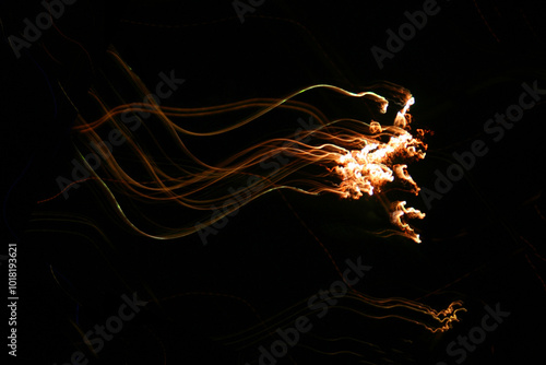 Long exposure fireworks shot. Horizontal flashes from right to left