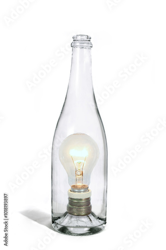 Surreal photo montage of glass bottle with light bulb inside