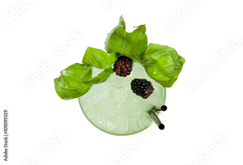 фотографія Overhead shot of cocktail glass with basil garnish with blackberries and two bla