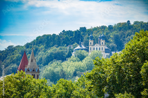 Kappele Sanctuary Church spires on forested hillside in Wurzburg photo