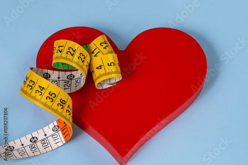 red heart shape with measuring tape symbolizing health care