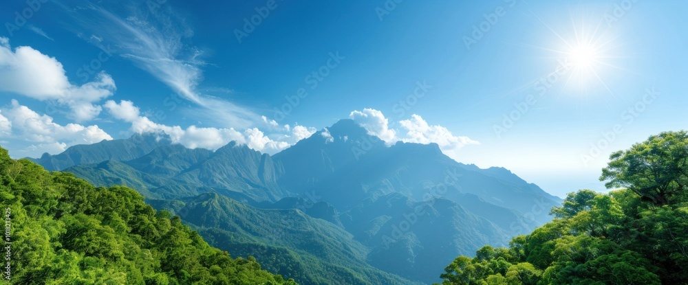 Fototapeta premium Breathtaking Panoramic View of Majestic Mountains and Lush Greenery Under a Clear Sky