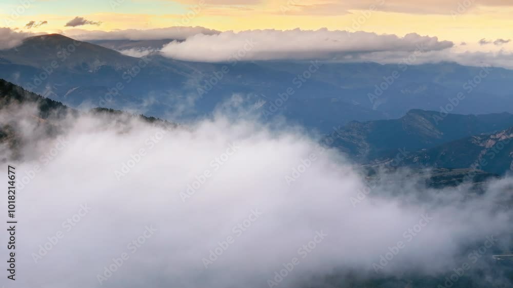 Mountain cinematic aerial view fly above clouds at sunset on beautiful landscape Mountain cinematic aerial view fly above clouds at sunset on beautiful landscape