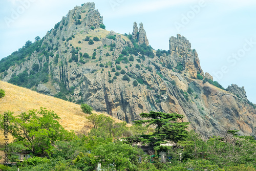 Eastern part of Crimean Mountains. Karadag volcano with basalt lava remnants (stone pillars) 150 million years ago as manifestation of Middle Jurassic volcanism, eolian erosion photo