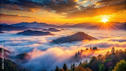 Misty sunrise in the mountains during spring and summer