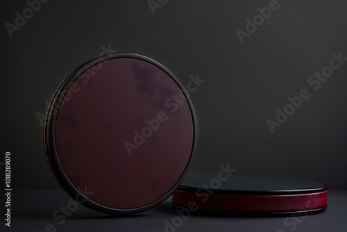 Minimalist black background, high-res, round mirror, maroon case, left side, dark grey backdrop, sharp focus, copy space photo