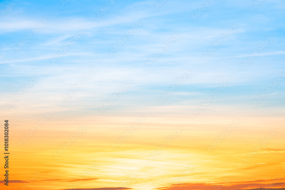 Obraz premium Beautiful , luxury soft gradient orange gold clouds and sunlight on the blue sky perfect for the background, take in everning,Twilight, Large size, high definition landscape photo