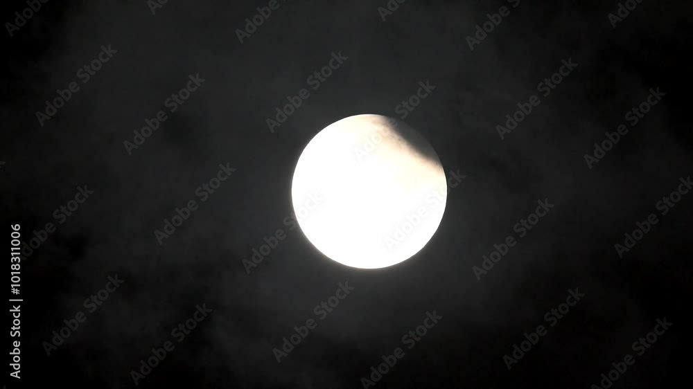 Partial lunar eclipse Full moon and lunar eclipse Full moon between the clouds Super moon 2024 light in the night Partial lunar eclipse Full moon and lunar eclipse Full moon between the clouds Super moon 2024 light in the night