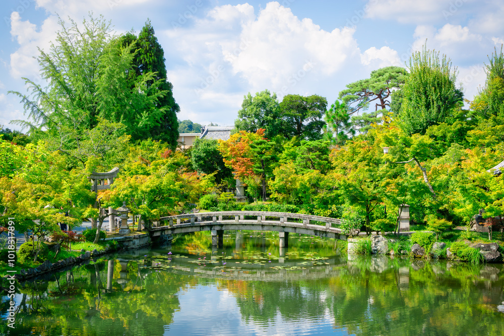 Traditional Japanese Garden, Kyoto. Bridge in Japanese Garden during summer. Refections in the water. Heian Jingu Garden. Traditional Japanese Garden, Kyoto. Bridge in Japanese Garden during summer. Refections in the water. Heian Jingu Garden.