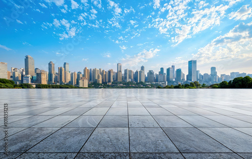 Fototapeta Naklejka Na Ścianę i Meble -  Empty marble floor overlooking modern city skyline with blue sky