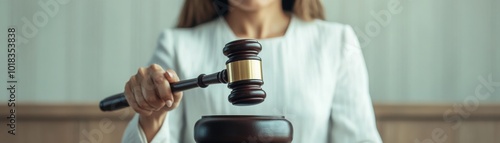 A judge in a courtroom actively using a gavel, symbolizing authority and legal judgment in the justice system.