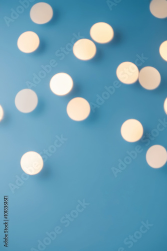 A blue background with lights with a soft, blurred focus all over the image