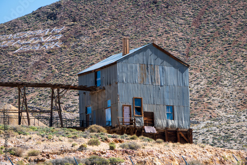 Old abandoned silver mine in Tonopah, Nevada. Rusty buildings and machines photo