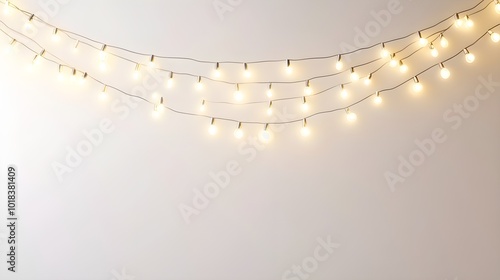 String of Warm White Christmas Lights on White Wall photo