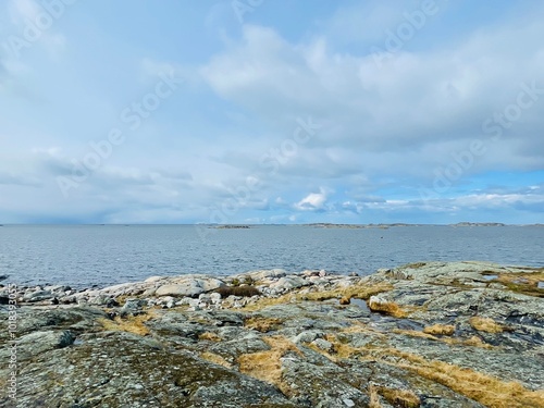 A view of red wooden houses on Vrango Archipelago island . photo