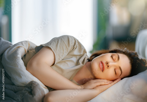 woman is sleeping in the bedroom