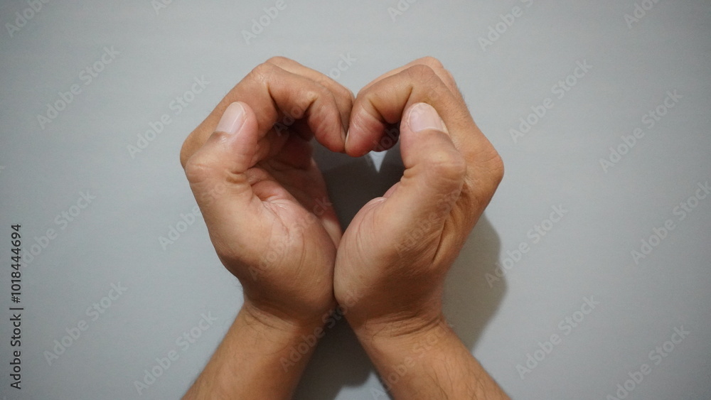 Fingers as a sign of affection or love language isolated on a gray background
Fingers as a sign of affection or love language isolated on a gray background