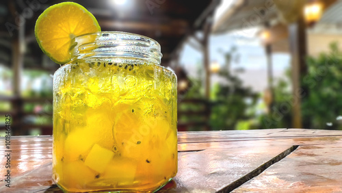 Fresh drink garnished with lemon on the cafe table