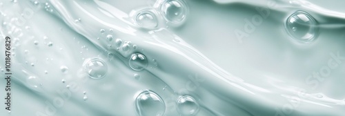 Macro view of transparent bubbles and droplets on a smooth, pale aqua surface, creating a serene and pure aesthetic perfect for skincare or spa themes.