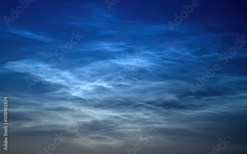 Rare noctilucent clouds at summer night sky