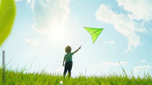 Child Flying Kite Under Bright Blue Sky