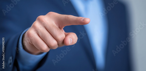 Businessman's fingers pointing forward for business concept.