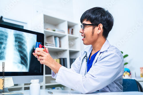 Professional cardiologist uses a heart model to demonstrate the anatomy, function, and treatment or stethoscope, surgeon of cardiovascular diseases including heart attacks and strokes, use stethoscope