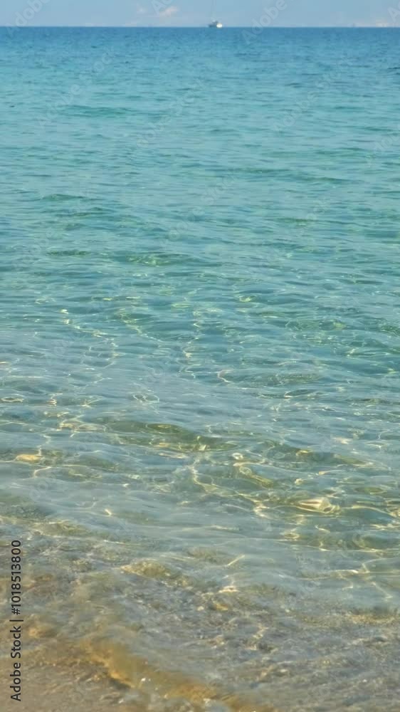 Beautiful, clear blue sea washing up onto golden sand Beautiful, clear blue sea washing up onto golden sand