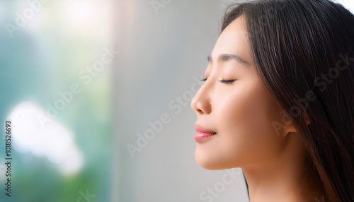 portrait of a woman with her eyes closed, exudes calm and tranquility, warm lighting enhances her relaxed expression, creating a peaceful and meditative atmosphere, mindfulness, relaxation, wellness