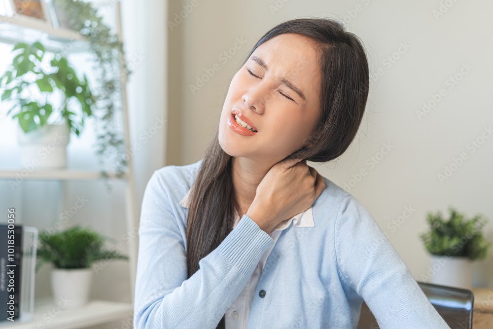 Body muscles stiff problem, ache asian young woman, girl pain neck while sitting work on chair at home, holding massaging rubbing, hurt or sore, Healthcare people, office syndrome. Body muscles stiff problem, ache asian young woman, girl pain neck while sitting work on chair at home, holding massaging rubbing, hurt or sore, Healthcare people, office syndrome.