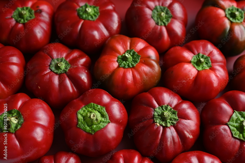 texture of red bell peppers as a background, autumn ripe juicy red bell peppers as a background, juicy organic food texture of red bell peppers as a background, autumn ripe juicy red bell peppers as a background, juicy organic food