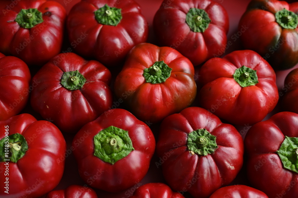 texture of red bell peppers as a background, autumn ripe juicy red bell peppers as a background, juicy organic food texture of red bell peppers as a background, autumn ripe juicy red bell peppers as a background, juicy organic food