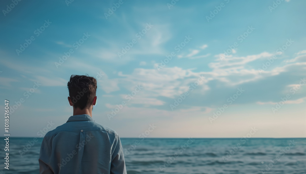 Man Gazing at Tranquil Ocean Horizon Under Clear Blue Sky - Contemplative Seaside Scene Photograph Man Gazing at Tranquil Ocean Horizon Under Clear Blue Sky - Contemplative Seaside Scene Photograph