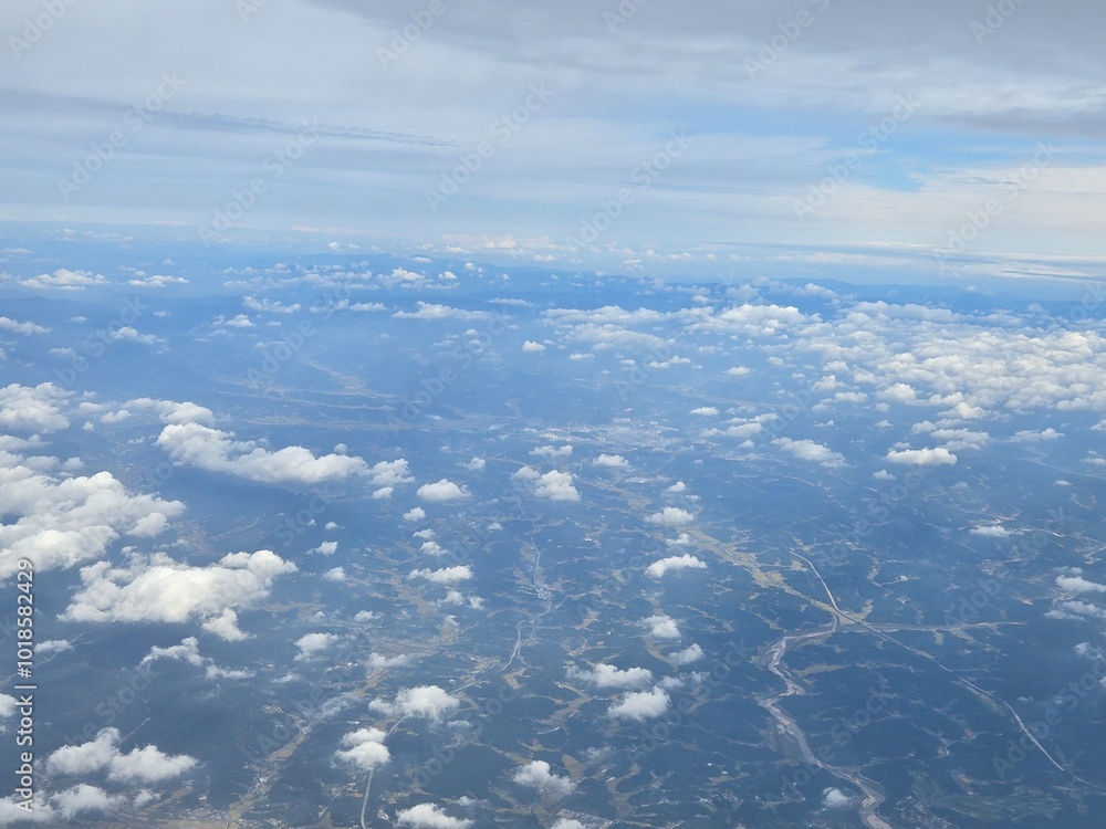 Stunning Aerial View of Clouds and Clear Blue Sky – Scenic Atmosphere, Fluffy White Clouds in the Stratosphere Stunning Aerial View of Clouds and Clear Blue Sky – Scenic Atmosphere, Fluffy White Clouds in the Stratosphere