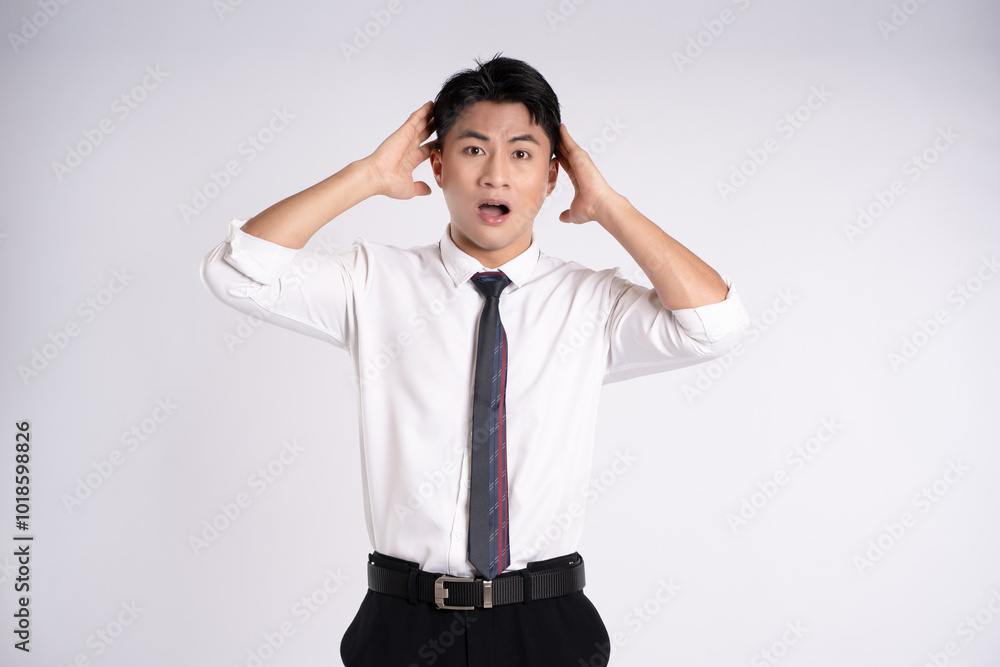 Portrait of young Asian business man posing on white background Portrait of young Asian business man posing on white background